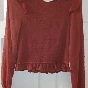 Chic Rust Smocked Blouse with Ruffle Hem